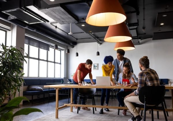 diverse-male-female-colleagues-discussion-using-laptop-tablet-casual-office-meeting-casual-office-communication-teamwork-business-creative-work-unaltered_13339-338558